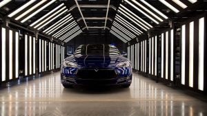 A Tesla Model S automobile stands in a light tunnel during quality control checks ahead of European shipping from the Tesla Motors Inc. factory in Tilburg, Netherlands, on Thursday, Oct. 8, 2015. Tesla said it delivered 11,580 vehicles in the third quarter, meeting its target after Chief Executive Officer Elon Musk handed over the first Model X sport utility vehicles just before the end of the period. Photographer: Jasper Juinen/Bloomberg via Getty Images